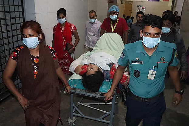Judge’s wife Tasnim Nahar, who was injured in the attack, is being moved from the operating room to the ward on Thursday evening at Rajshahi Medical College Hospital.