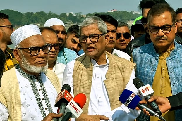 BNP secretary general Mirza Fakhrul Islam Alamgir speaks to newspersons after paying visit to the rubber dam built over the Mahananda River in Chapainawabganj.