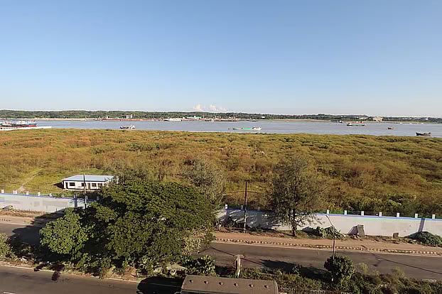 A view of Laldia Char in Patenga on the right bank of the Karnaphuli River. The Chittagong Port Authority has signed an agreement with Denmark’s APM Terminals to build a container terminal here. The char is covered with grass up to the boundary wall. Photo taken yesterday, Tuesday afternoon in the Bijoynagar area of Laldia Char, Patenga.