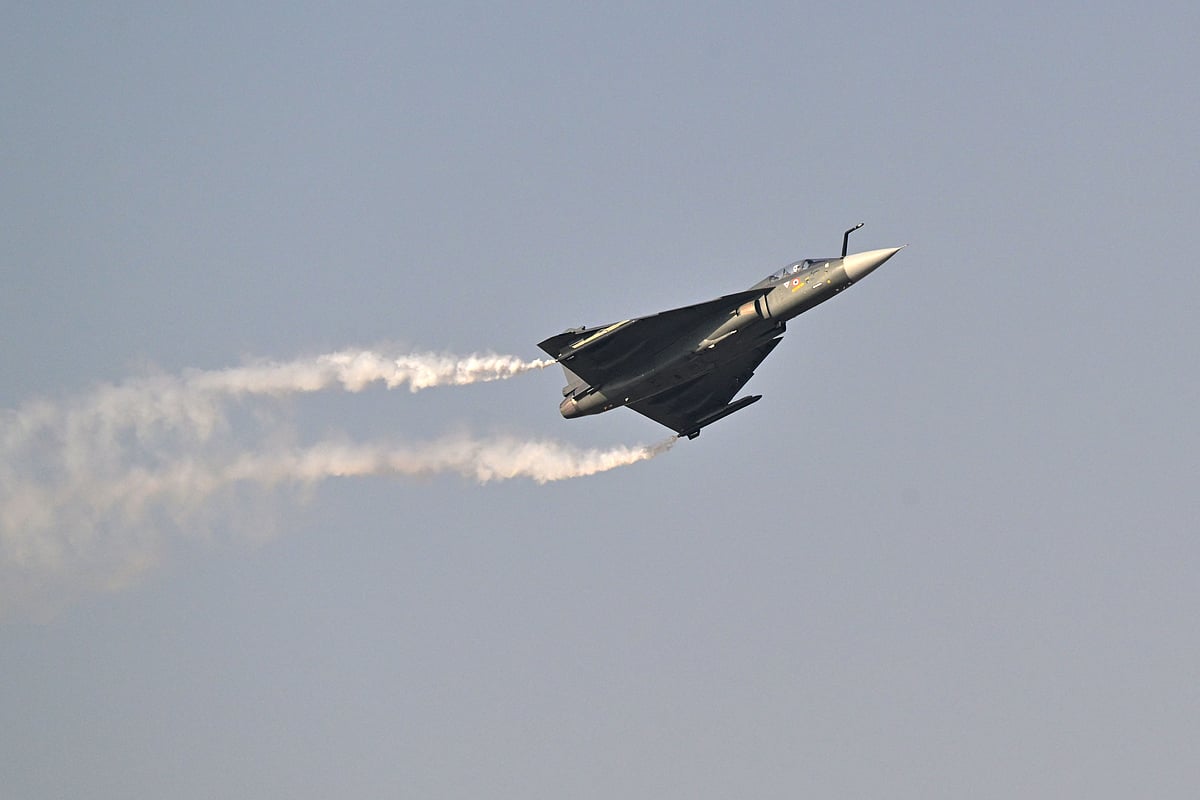 Indian Air Force's HAL Tejas performs is performing a display flight at Al-Maktoum International Airport during the Dubai Airshow 2025 in Dubai on 20 November 2025.