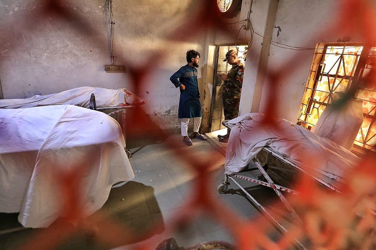 The remains of three earthquake victims at the Mitford Hospital morgue in Dhaka on 21 Novemmber 2025.
