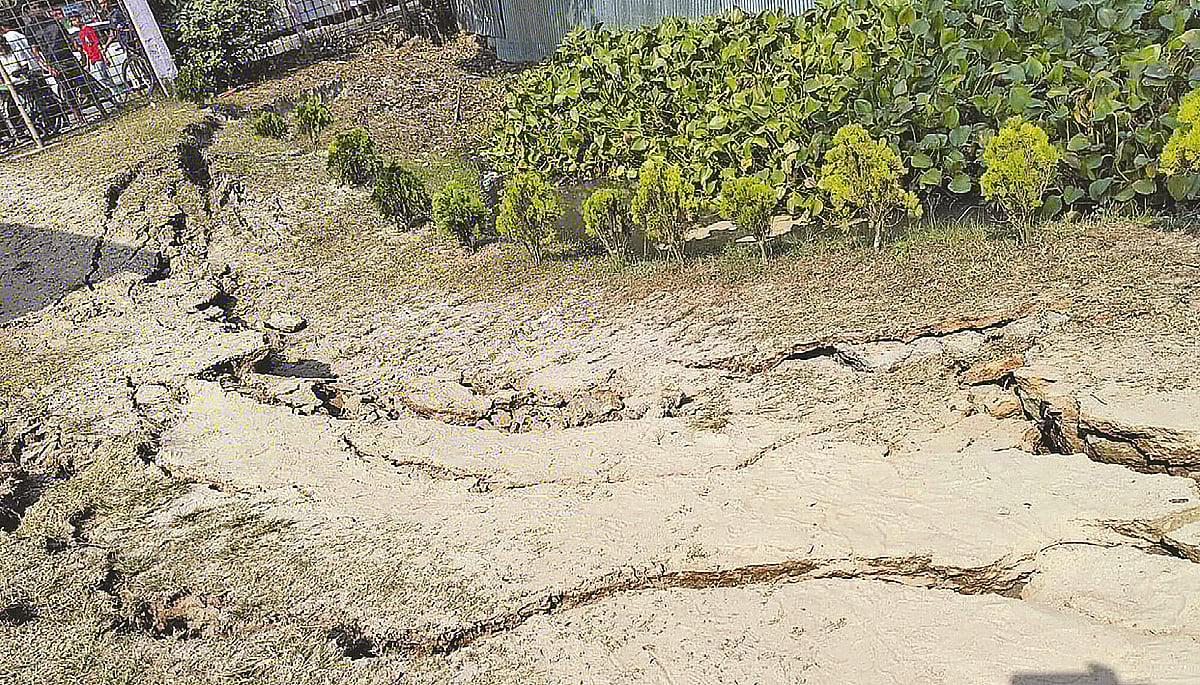A section of the dirt road in front of Palash Residential Model School and College, near the Dorihawlapara bus stand in Palash, developed visible cracks following the earthquake.