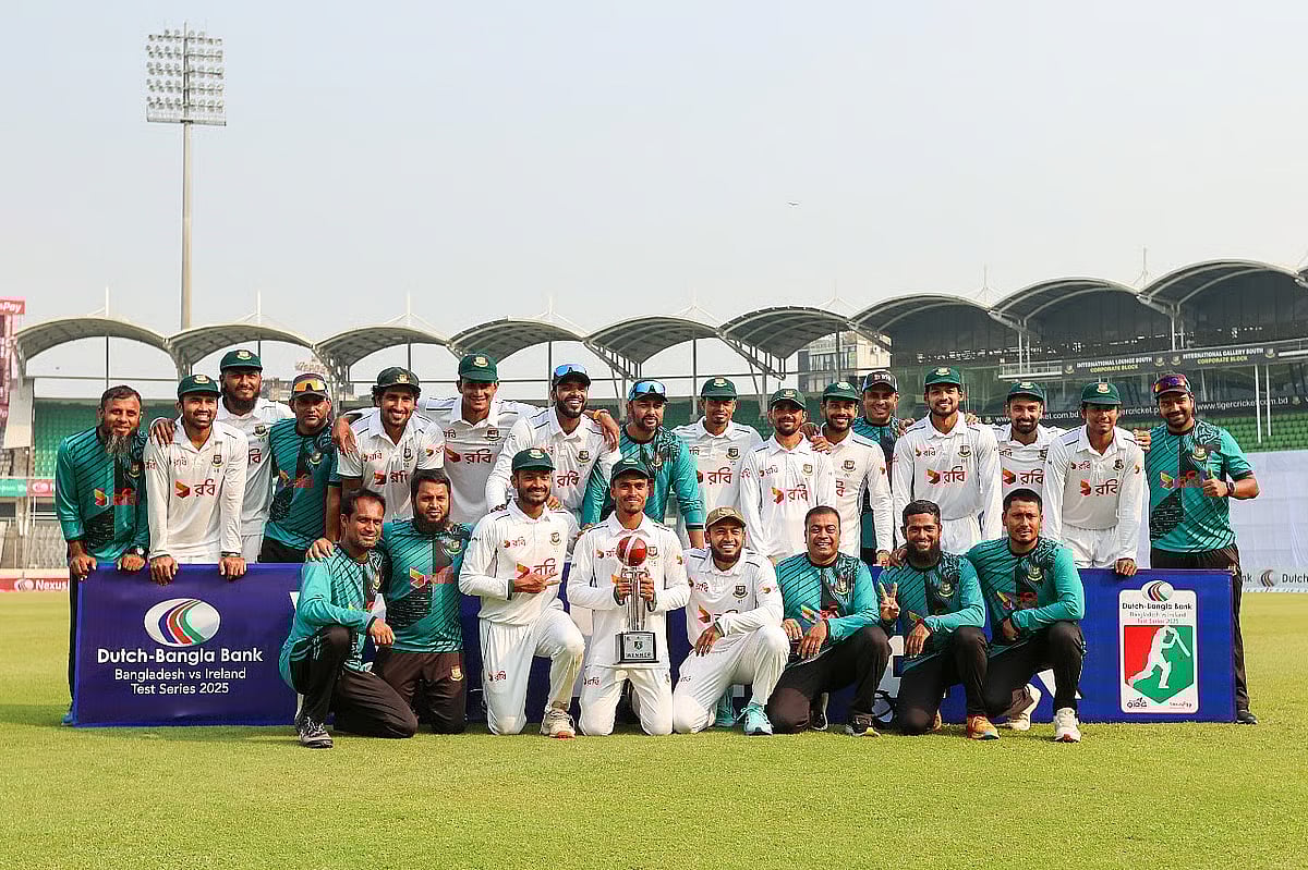 Bangladesh team pose for a photograph with the trophy after sweeping the two-match Test series by 2-0 at Sher-e-Bangla National Cricket Stadium, Mirpur, Dhaka on 23 November 2025