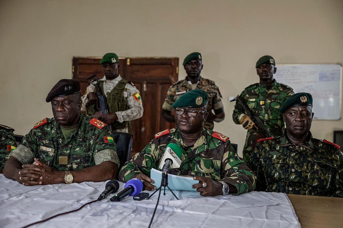 Brigadier General Denis N'Canha (C), head of the military office of the presidency gives a press conference at the General Staff of the Armed Forces on 26 November, 2025.