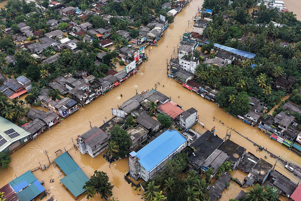 An aerial view shows houses partially submerged in floodwaters after heavy rainfall in Kaduwela on the outskirts of Colombo on 29 November, 2025