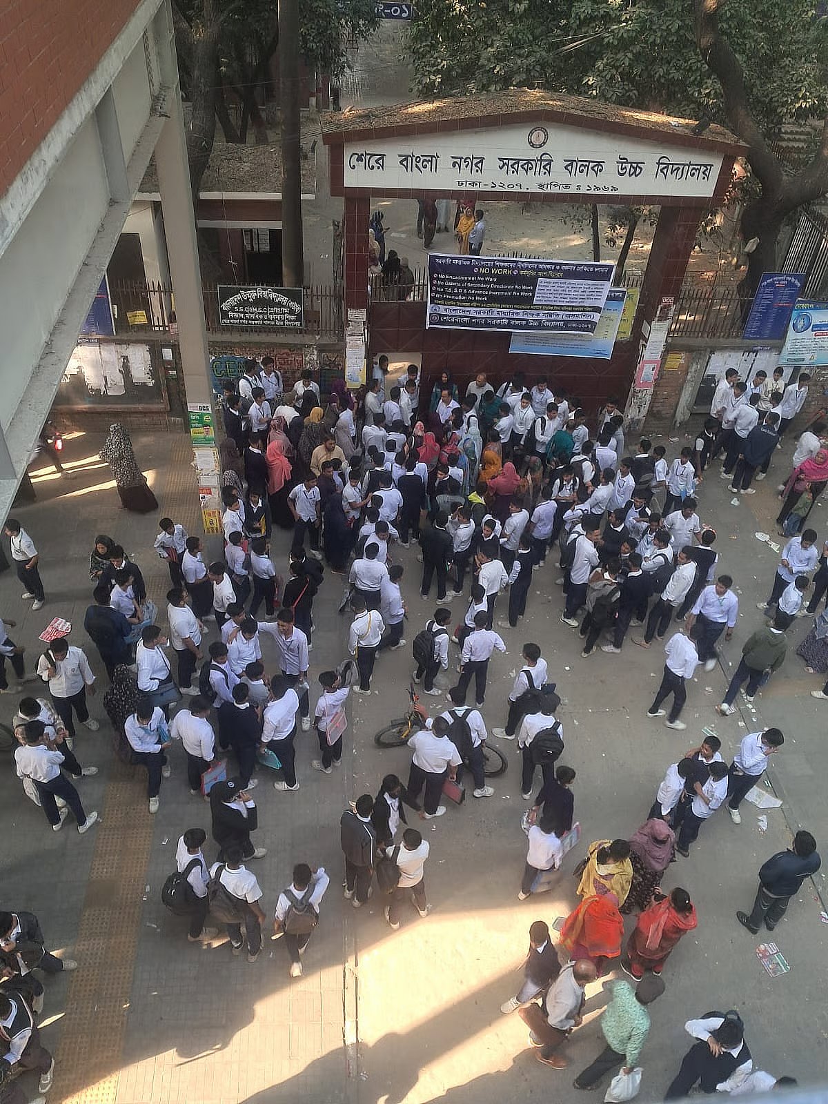 A strike notice is displayed at the gate of Sher-e-Bangla Nagar Government Boys High School in Dhaka on 1 December 2025.