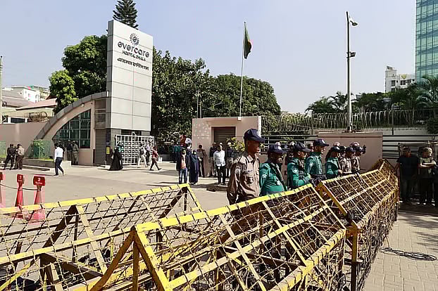 The main gate of the hospital has been surrounded by barbed wire barricades.