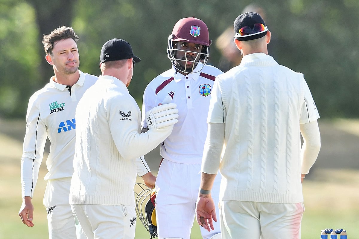 West Indies' Justin Greaves (C) shakes hands with the New Zealand team after a draw during day five of the first Test cricket match between New Zealand and West Indies at Hagley Oval in Christchurch on 6 December 2025.