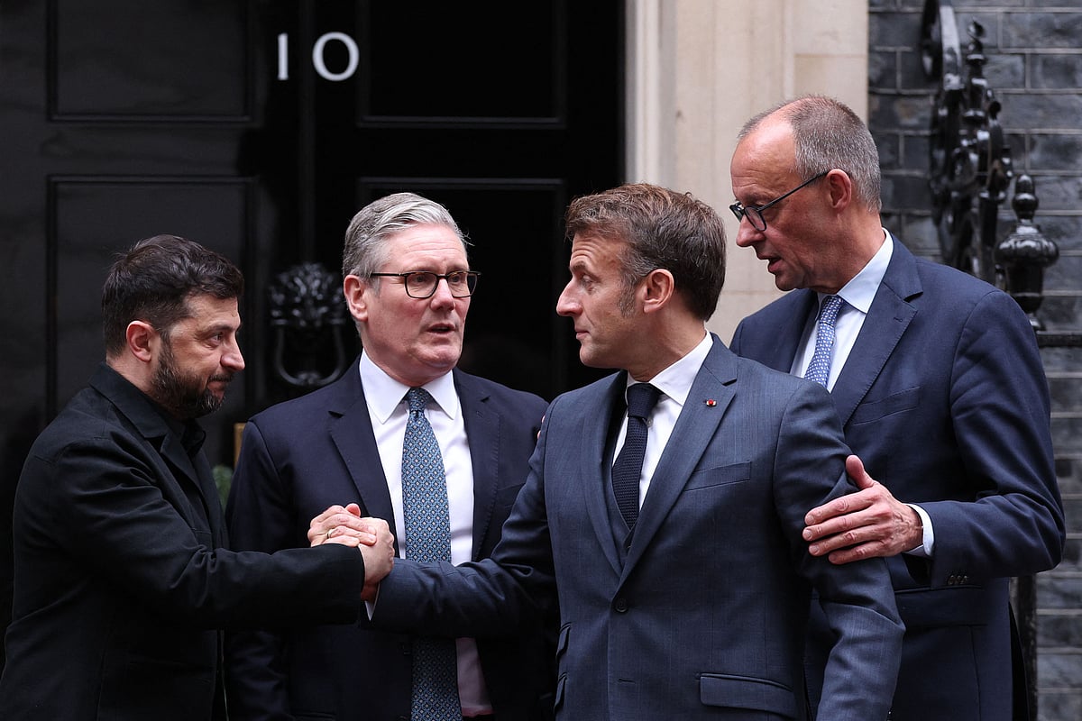 Ukraine's President Volodymyr Zelensky, Britain's Prime Minister Keir Starmer, France's President Emmanuel Macron and Germany's Chancellor Friedrich Merz chat on the 10 Downing Street doorstep after a meeting in central London on December 8, 2025.