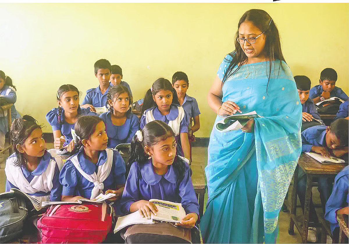 A teacher conducts a class at Uttam Bagharia Government Primary School in Rangpur.
