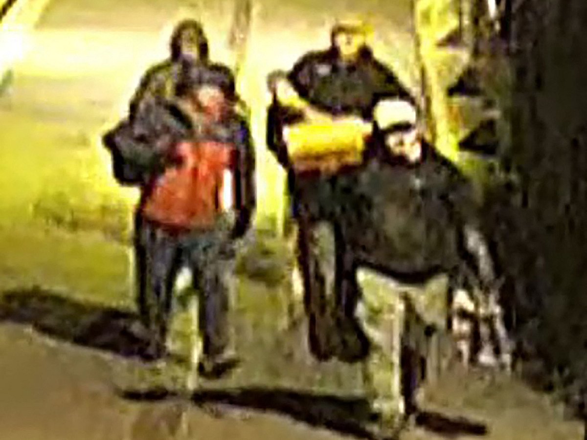 This handout image of CCTV footage released by Avon and Somerset Police on 11 December, 2025 shows men carrying bags in the early hours of 25 September in the city of Bristol, south-west England outside a building which housed items from the Bristol Museum’s British Empire and Commonwealth collection.
