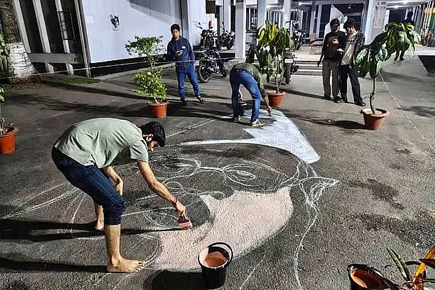 Inside Jagannath Hall, pictures of Jamaat leaders Ghulam Azam, Motiur Rahman Nizami, and Quader Mollah, convicted of war crimes, are being painted on the floor.