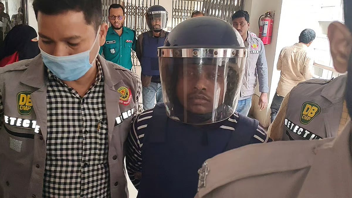 Police escort Md Kabir, a close associate of Faisal Karim, prime suspect in the shooting of Sharif Osman Hadi, to the Chief Metropolitan Magistrate (CMM) Court on 16 December 2025.