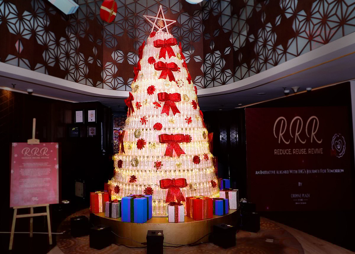 Reduce. Reuse. Revive. Christmas tree made of recycled plastic bottles