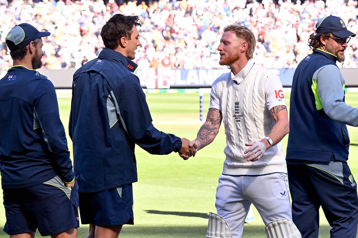 England's captain Ben Stokes (2nd R) shakes hands with Australia's Pat Cummins (2nd L) on the second day of the fourth Ashes cricket Test match between Australia and England at the Melbourne Cricket Ground (MCG) in Melbourne on 27 December 2025.