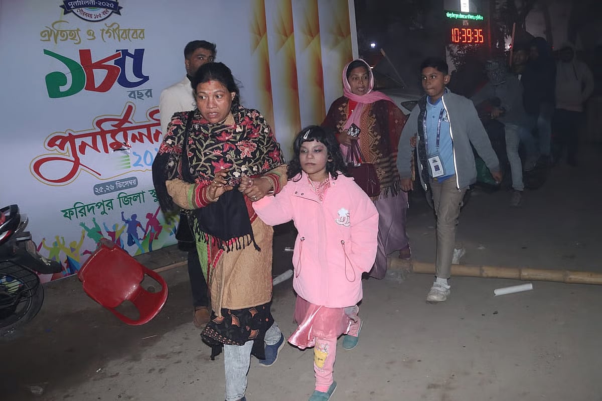 Audience leave the venue after the concert was called off at the Faridpur Zilla School ground on 26 December 2025.