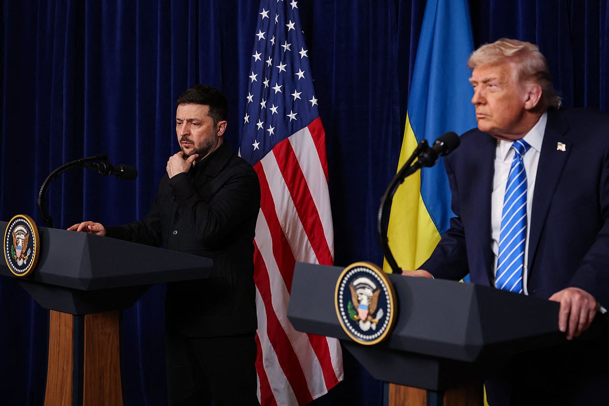 Ukrainian President Volodymyr Zelensky listens as U.S. President Donald Trump speaks during a press conference following their meeting at Trump’s Mar-a-Lago club on 28 December, 2025 in Palm Beach, Florida.