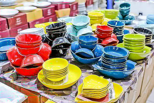 Colourful crockery being sold from cycle vans