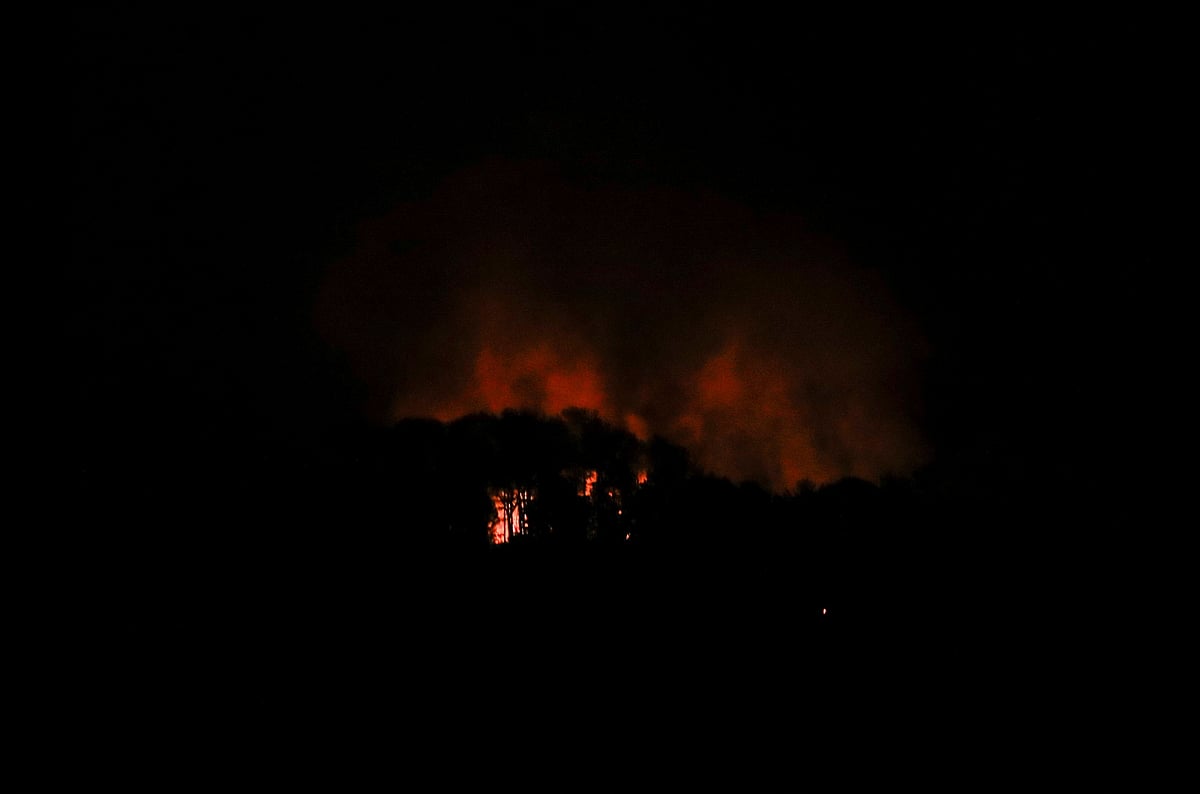 Smoke rises near Fort Tiuna, a military zone, during a full blackout, following explosions and loud noises, amid rising tensions between administrations of U.S. President Donald Trump and Venezuelan President Nicolas Maduro, in Caracas, Venezuela, 3 January 2026.
