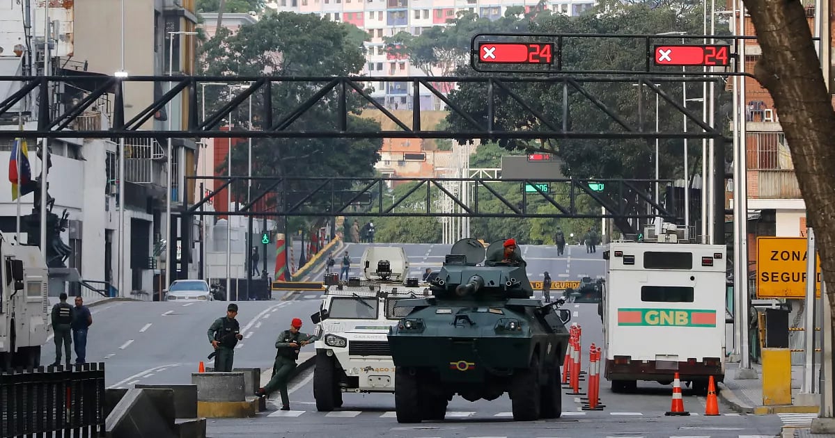 National Guard armored vehicles block an avenue leading to Miraflores presidential palace in Caracas, Venezuela, Saturday, 3 January, 2026.