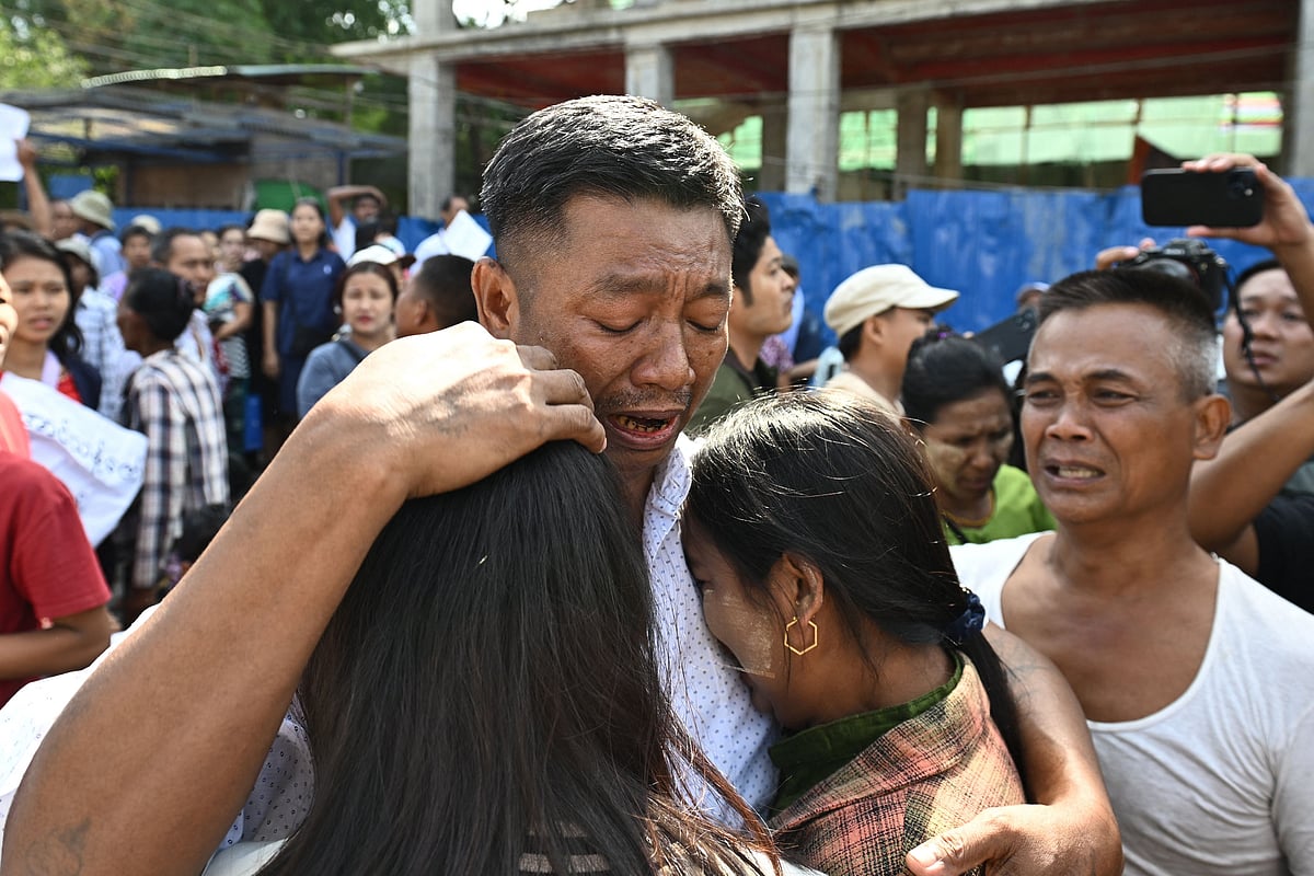Relatives celebrate with a man after he was released during an annual amnesty to mark Myanmar’s independence day outside Insein prison in Yangon on 4 January 2026