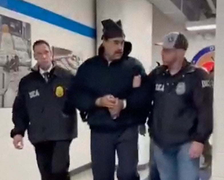 This screengrab taken from the X account of Rapid Response 47, the official White House rapid response account, shows Venezuelan President Nicolas Maduro (C) escorted by DEA agents inside the headquarters of the US Drug Enforcement Administration (DEA) in lower Manhattan, New York, on January 3, 2026