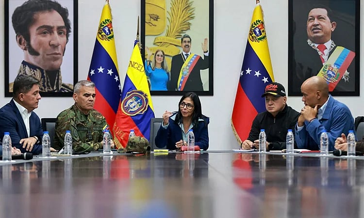 Venezuela's interim president Delcy Rodriguez talks to officials