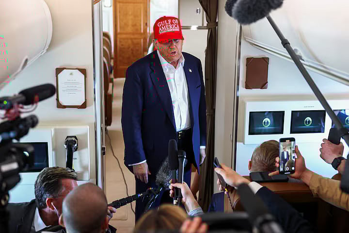 US President Donald Trump speaks to reporters aboard Air Force One en route to Joint Base Andrews, Maryland, after touring a temporary migrant detention center informally known as "Alligator Alcatraz" in Ochopee, Florida, US, 1 July 2025.