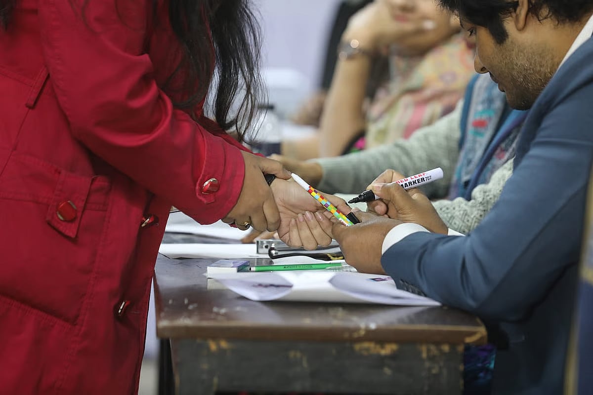 Ink being applied to voters’ fingers as voting is under way in the JnUCSU election on 6 January 2026.