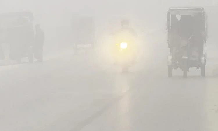 Roads and highways remain shrouded in fog since early morning, forcing vehicles to move with headlights on in Naogaon
