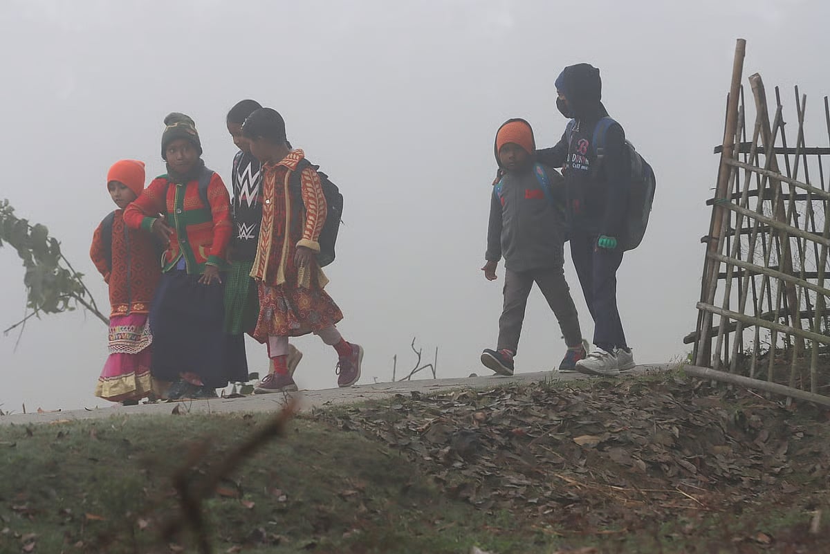 Children one the way to school in this cold weather, in Dolapara, Rangpur district. On 8 January.