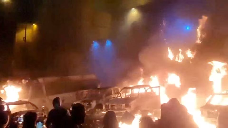 Protesters gather as vehicles burn, amid evolving anti-government unrest, in Tehran, Iran, in this screen grab obtained from a social media video released on 9 January, 2026.