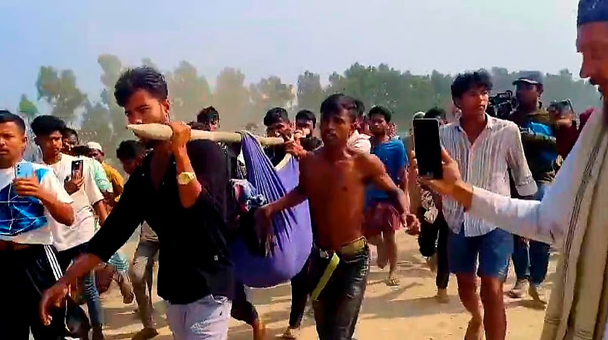 Locals rescue Md Hanif, who was injured in a mine explosion, in the Whykong border in Teknaf, Cox’s Bazar on 12 January 2026. 