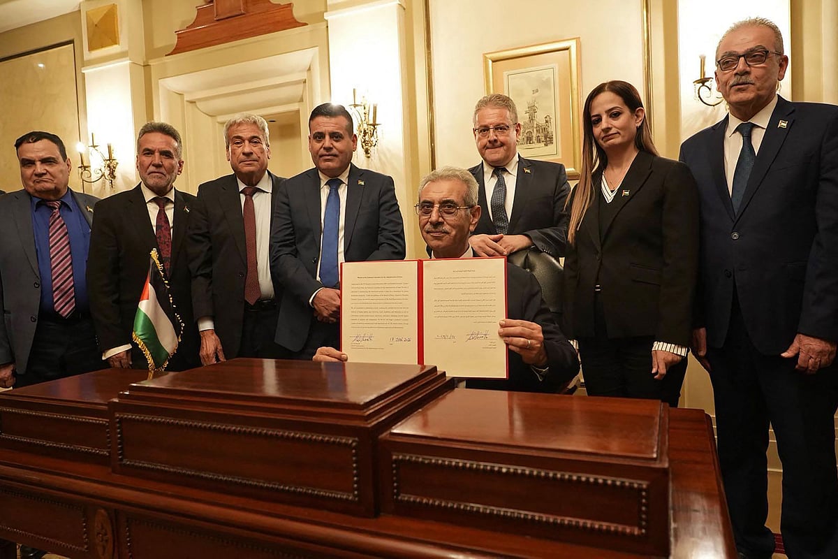 A handout photograph released by Egypt’s State Information Service shows Ali Shaath (C), head of the new Palestinian technocratic committee for administering the Gaza Strip, posing with its members during the inaugural meeting of 'National Committee for the Administration of Gaza' (NCAG), in Cairo on 18 January 2026.