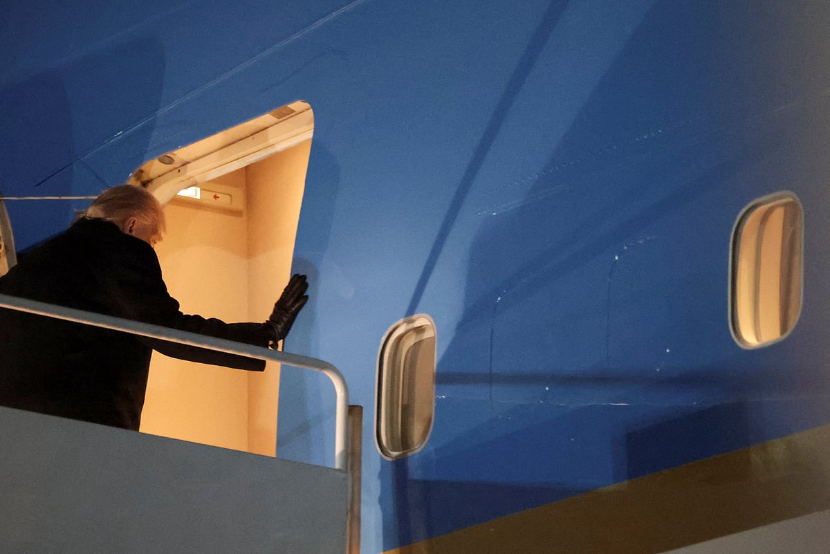 US President Donald Trump boards Air Force One for travel to the World Economic Forum in Davos, Switzerland, from Joint Base Andrews, Maryland, US, on 20 January 2026