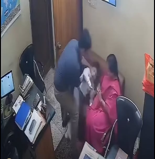 The child is being held by the principal, Sharmin Jahan, while the the school’s manager, Pabitra Kumar is beating him. 