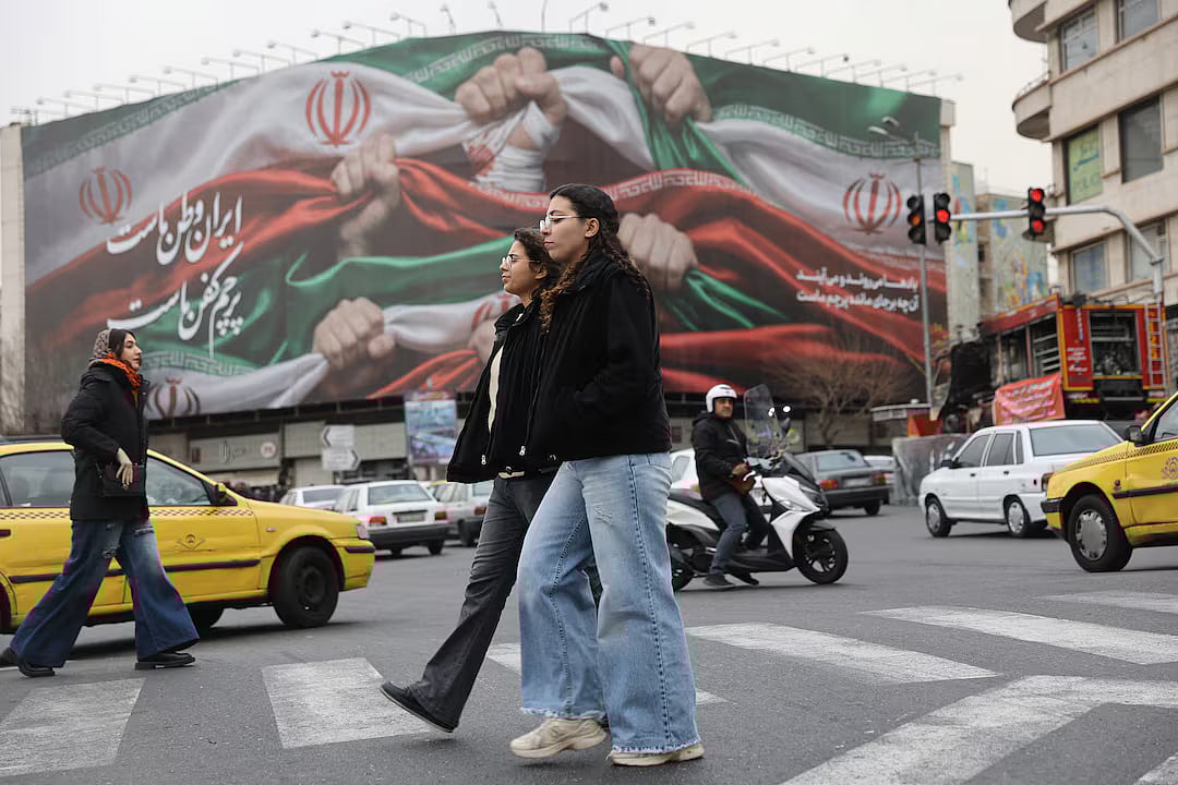 Iranian women walk on a street in Tehran, Iran, 19 January, 2026.