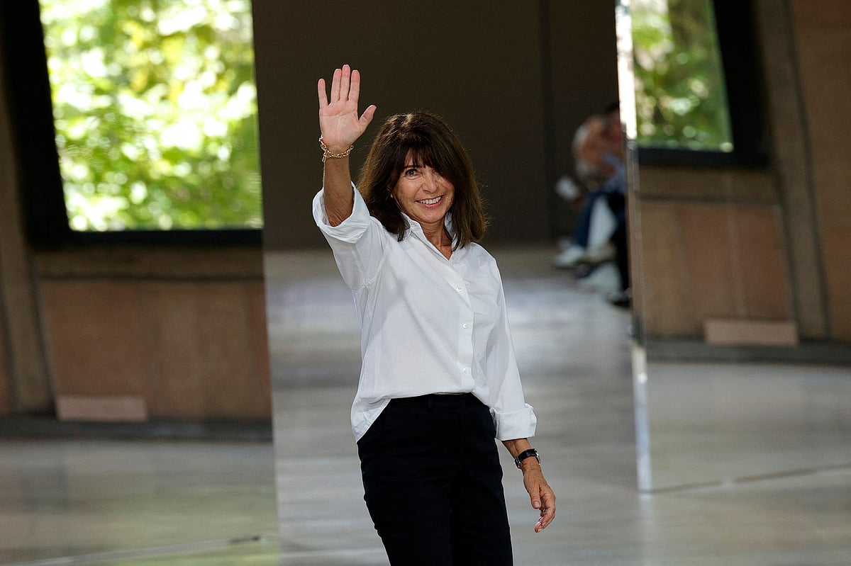 French fashion designer Veronique Nichanian waves to the audience at the end of the Hermes Menswear Spring-Summer 2026 collection show as part of the Paris Fashion Week at Place d'Iena in Paris, on 28 June, 2025.