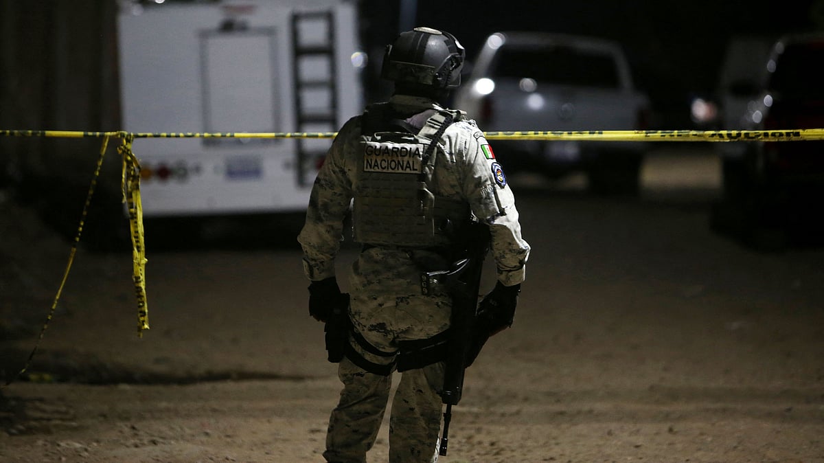 A member of the National Guard stands at the crime scene where at least 11 people were killed and 12 more wounded in Salamanca, Guanajuato state, Mexico, on 25 January, 2026