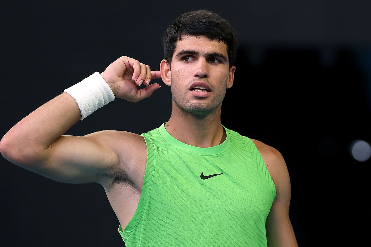 Spain's Carlos Alcaraz reacts on a point to Germany's Alexander Zverev during their men's singles semi-final match on day thirteen of the Australian Open tennis tournament in Melbourne on 30 January, 2026.