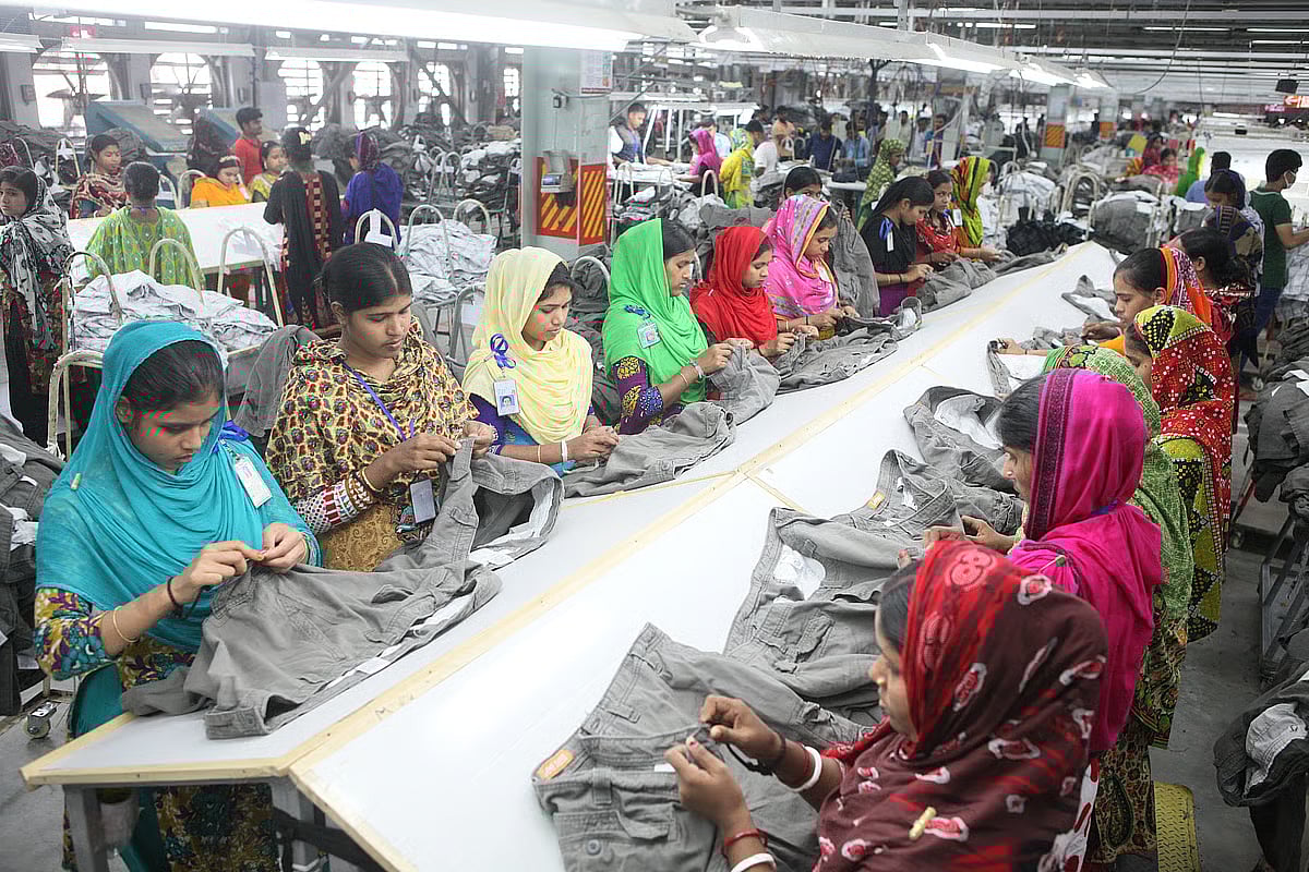 Women workers work at a readymade garments factory in Bangladesh.