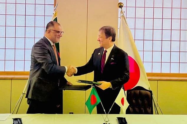 Bangladesh’s Commerce Adviser Sk Bashir Uddin and Japan’s State Minister for Foreign Affairs Hori Iwao shake hands after signing the EPA agreement in Tokyo, Japan, on 6 February 2026.