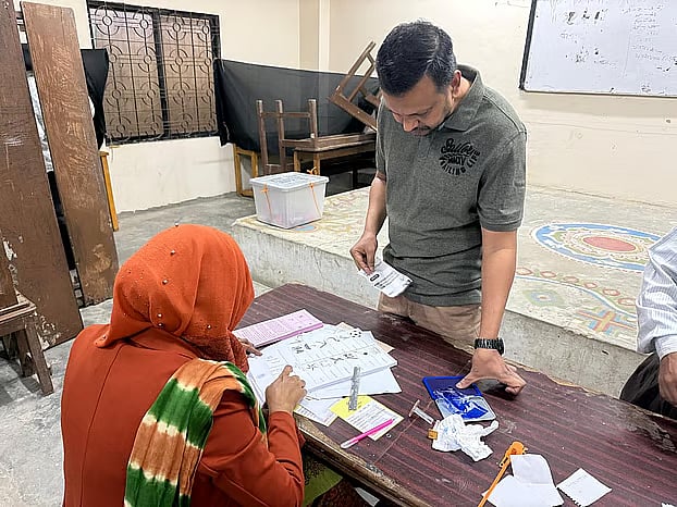 A voter arrives at a male polling centre at Mirpur University College, Dhaka. Photo taken around 8:15 am.
