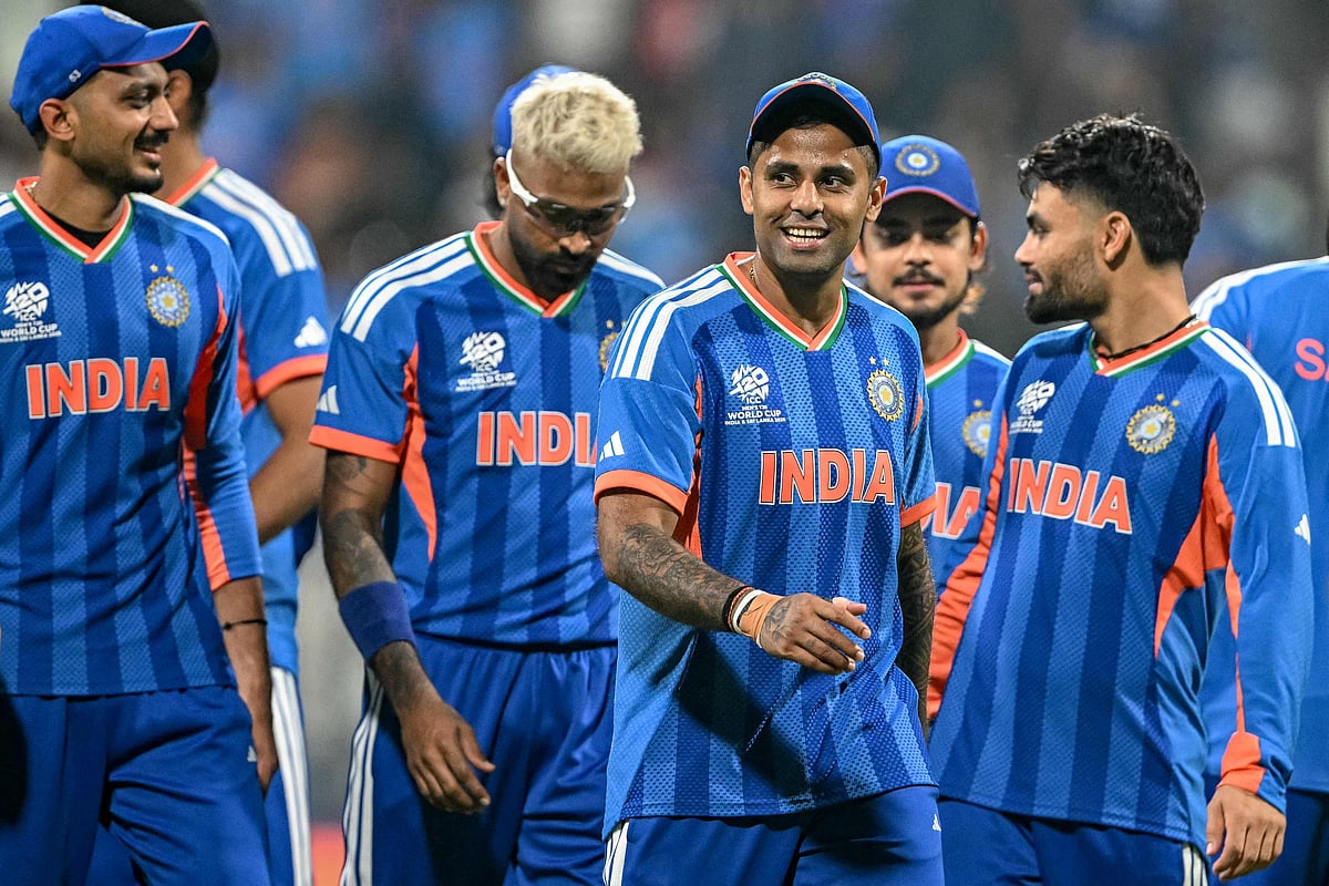 India's captain Suryakumar Yadav (C) and his teammates walk off the field after winning the 2026 ICC Men's T20 Cricket World Cup group stage match against USA at the Wankhede Stadium in Mumbai on 7 February, 2026