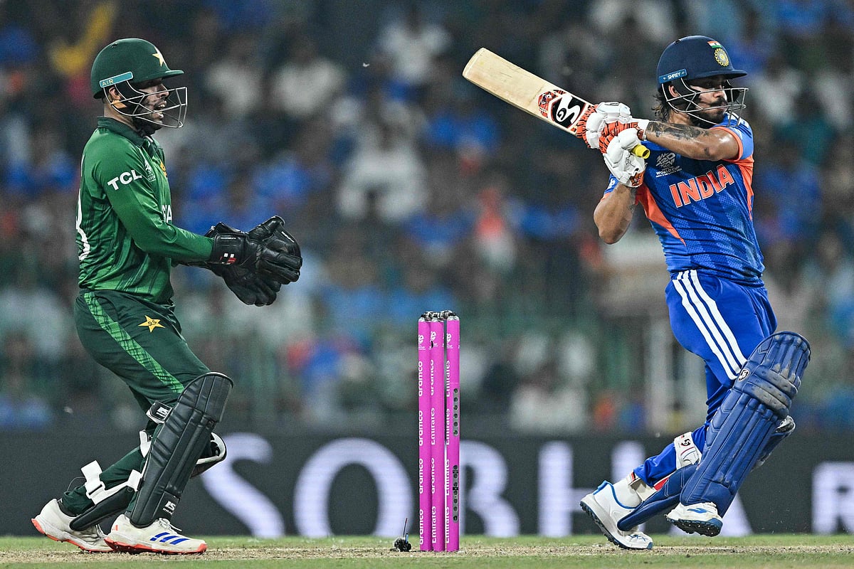 India's Ishan Kishan (R) plays a shot as Pakistan's wicketkeeper Usman Khan reacts during the 2026 ICC Men's T20 Cricket World Cup group stage match between India and Pakistan at the R Premadasa Stadium in Colombo on 15 February 2026.