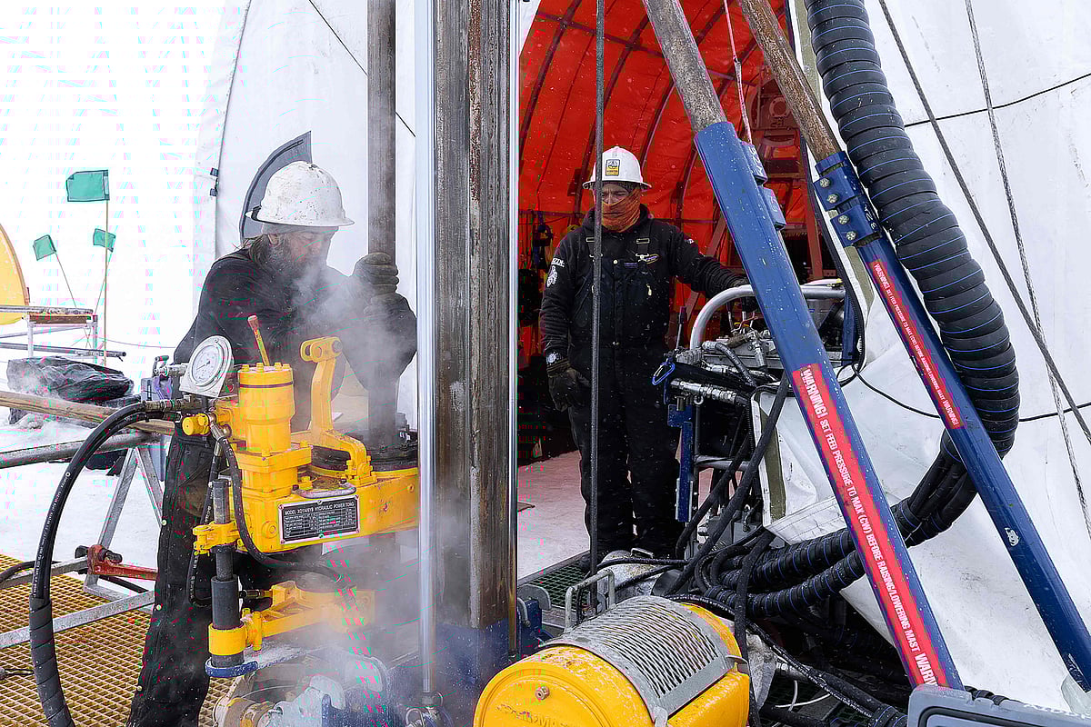 This handout photo dated January 6, 2026 and released by Ana Tovey/SWAIS2C on 17 February, 2026 shows drillers extracting a core to the surface at the drilling site in West Antarctica.