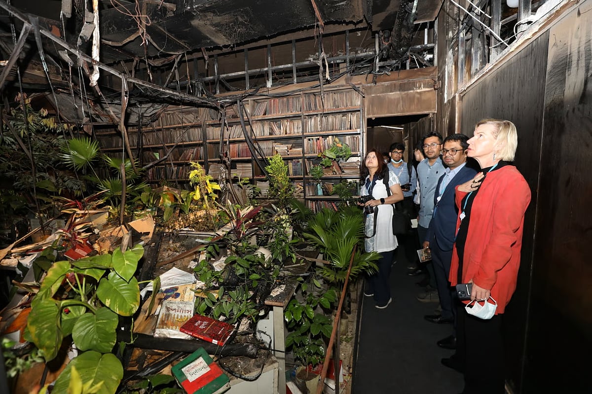 People visit the sixth day of the exhibition ‘Alo’ at the damaged building of Prothom Alo in Karwan Bazar, Dhaka, on 23 February 2026.