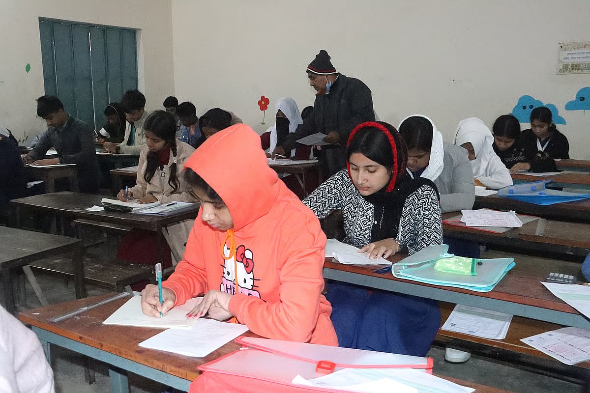 Candidates sit for the junior scholarship exam at Goalchamot Saroda Sundari Girls High School centre in Faridpur on 5 January 2026