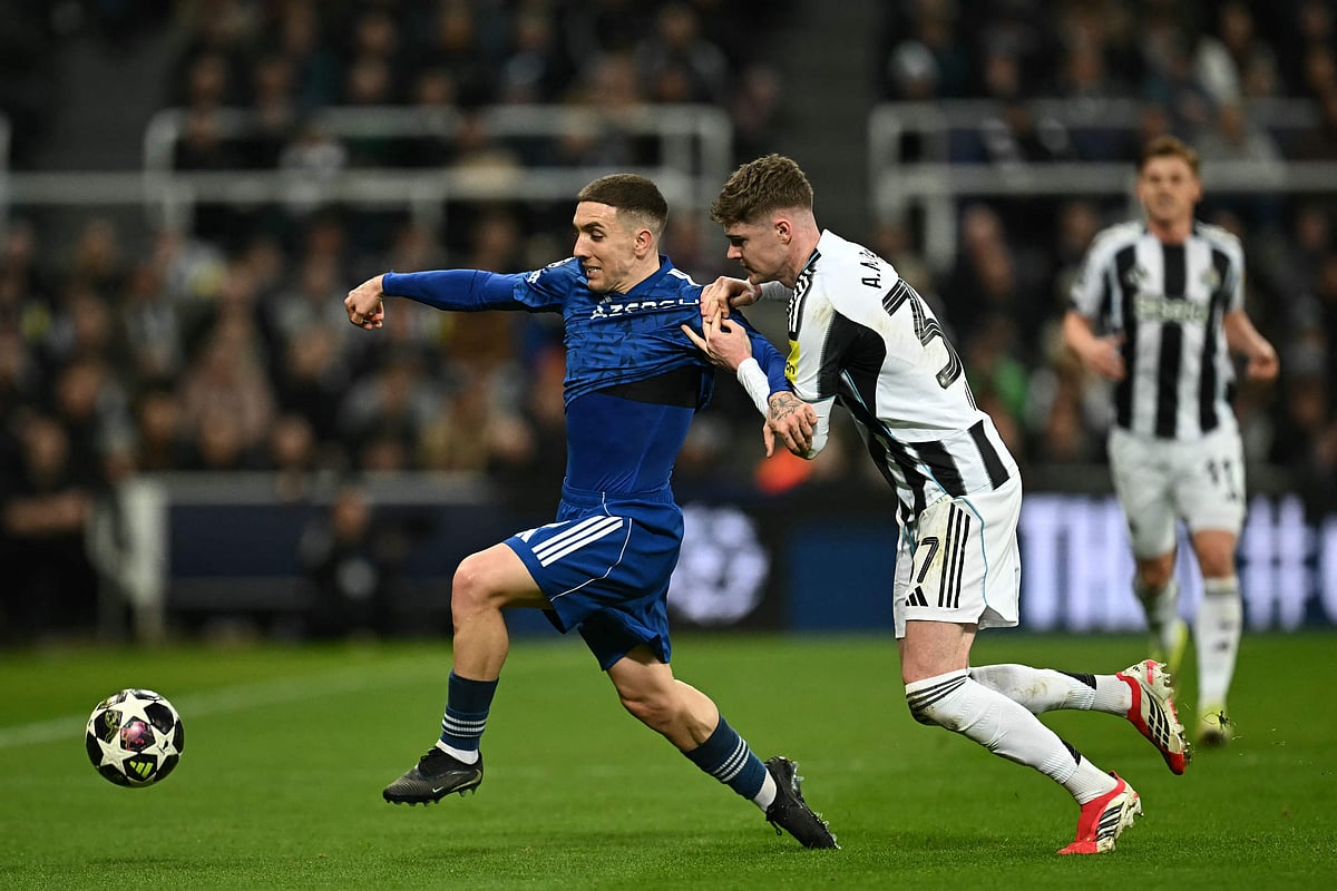 Qarabag’s Spanish midfielder #09 Jonatan Montiel Caballero (L) vies with Newcastle United’s Irish defender #37 Alex Murphy (C) during the UEFA Champion’s League knockout round play-off, 2nd leg football match between Newcastle United and Qarabag at St James’ Park in Newcastle-upon-Tyne, north east England on 24 February 2026