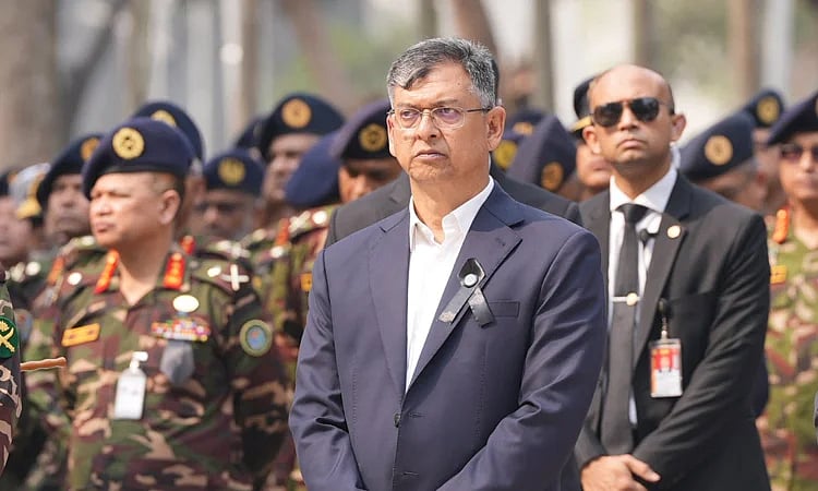 Home minister Salahuddin Ahmed during laying wreaths commemorating the kilings of army officers at the Pilkhana tragedy in 2009